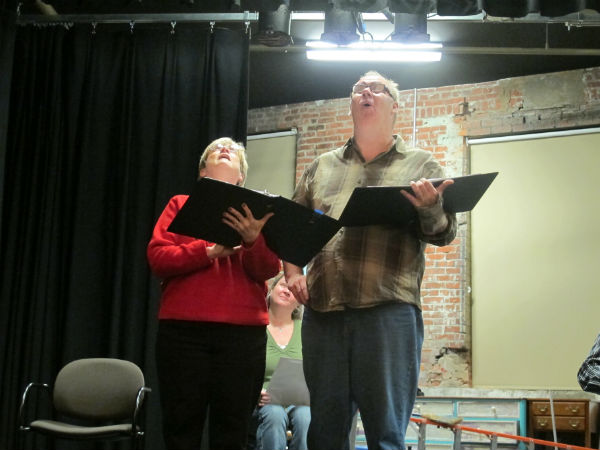 The show has a strong science fiction element to it. Here, Mary the landlady (Martha Boswell) stares up to discover all her cutlery is stuck to the ceiling. Professor Klaus (Brian O'Sullivan) is overjoyed at the success of his experiment with magnetism.