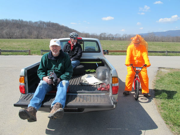 Ready for action. Filmmaker Hank Ebert on the back of the truck, with Chad in full costume.