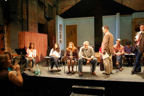 Mickey Ryan (standing) is Randy Mack, the ambitious attorney general of Texas. He talks with Jay Nickerson (seated), who plays Sheriff Spike Luckenbach.