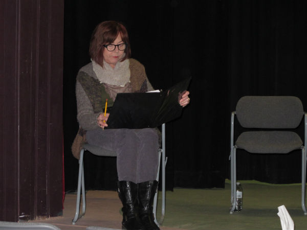 Showtimers president Vickie Haynie read stage directions.