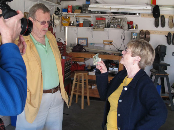 Charlie Boswell and Martha Boswell, who played Harold and Sally, who have a yard sale. That's Hank's arm at left.