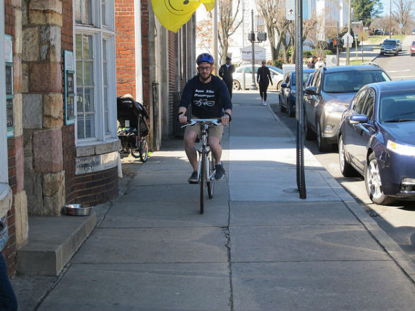 Blair Peyton delivering the package (shot in Grandin Village, outside Pop's Ice Cream.)