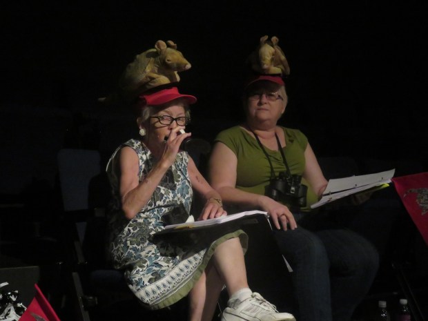 Our Greek chorus -- Cee Cee and Dee Dee, two fans who turn out for every football game. Yes, that's a flask. And armadillo hats.