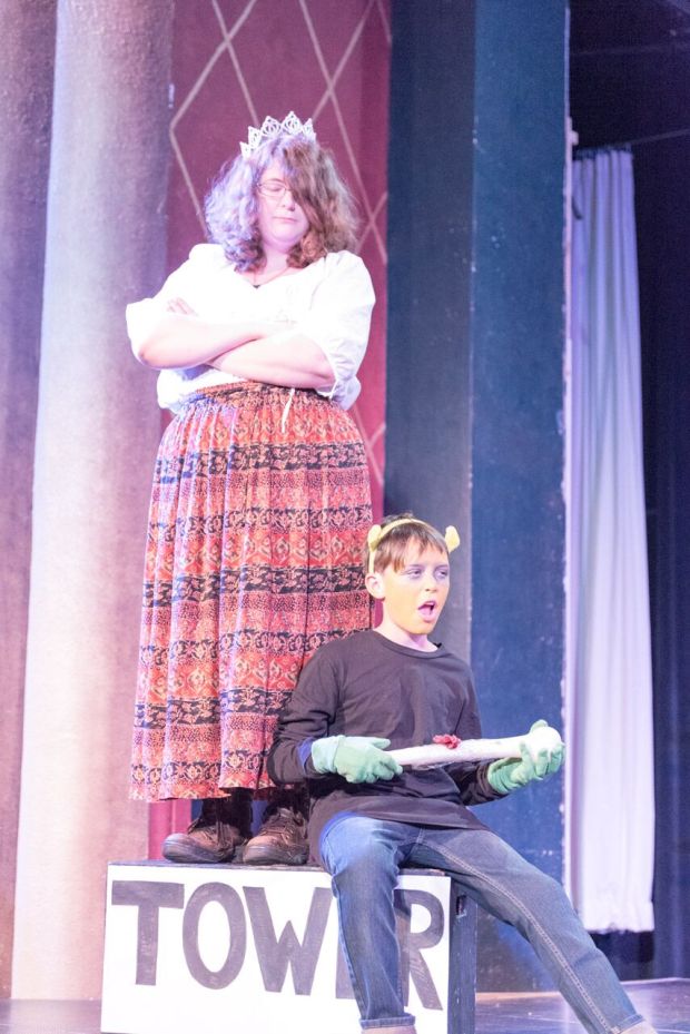 A damsel, state of distress uncertain, with an ogre.